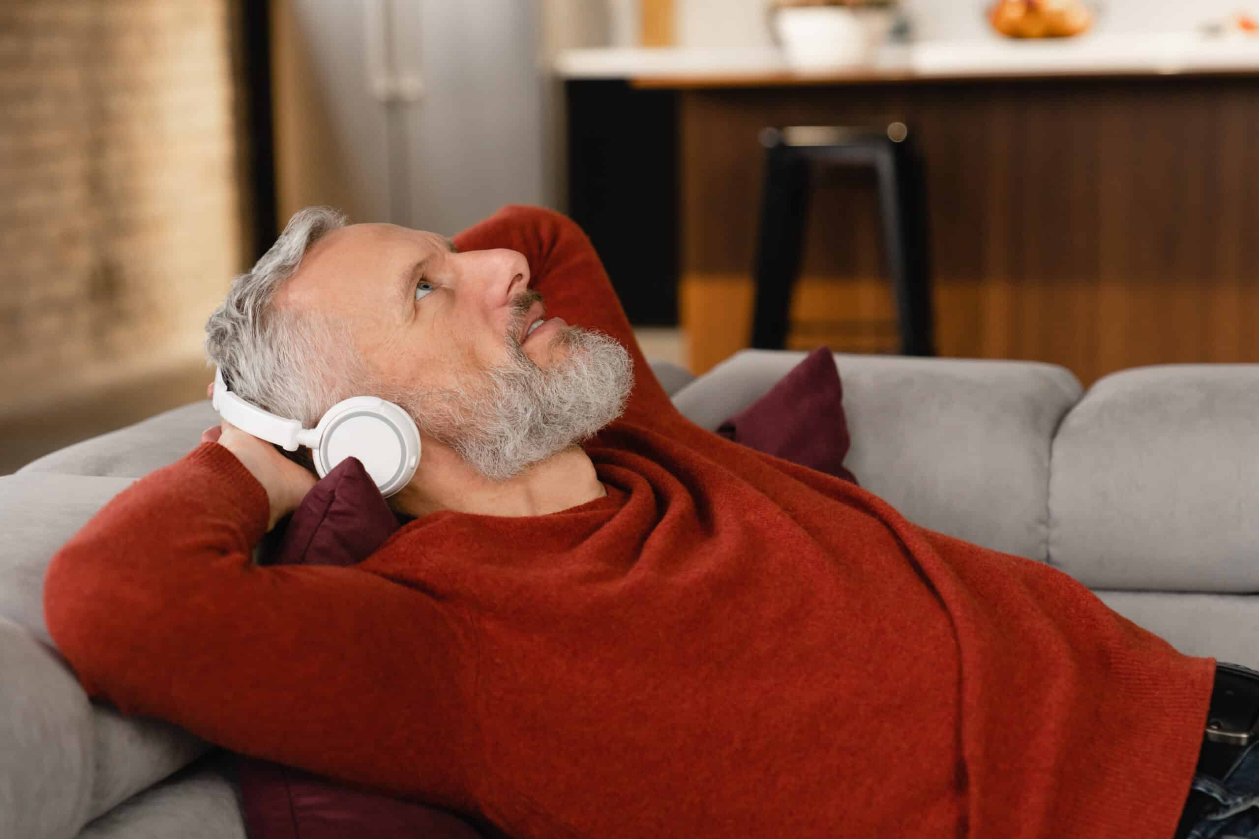 Man relaxing with headphones as part of a calming wellness environment that supports the bioresonance scan process and energetic balance.