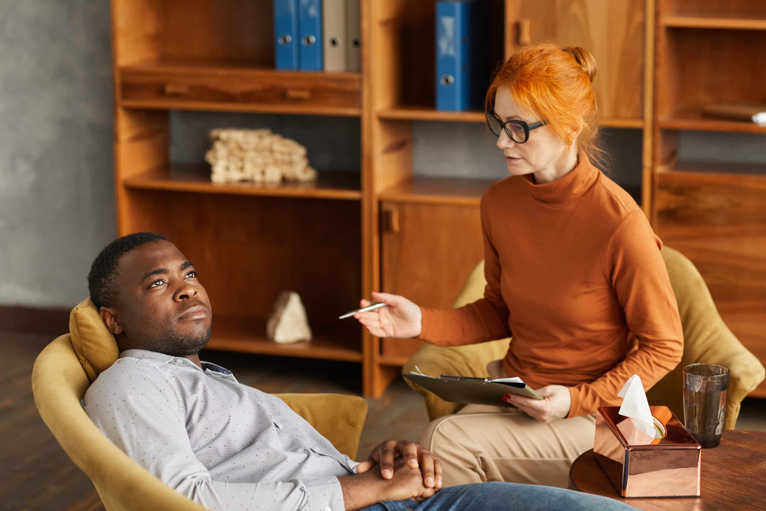 A holistic practitioner guiding a client through personalized wellness support that informs the restoration plan following a bioresonance scan.